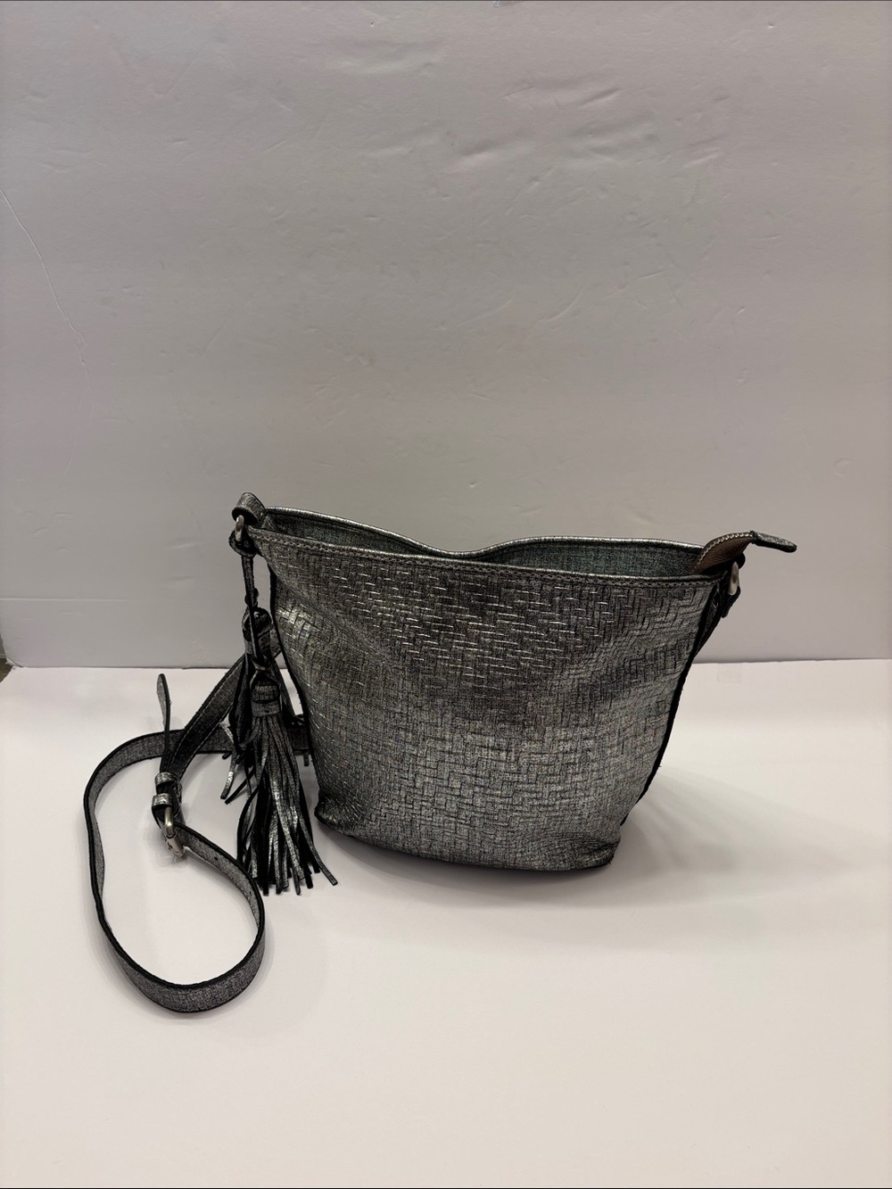 Patricia Nash Metallic Silver Crossbody Bucket Bag with Tassel